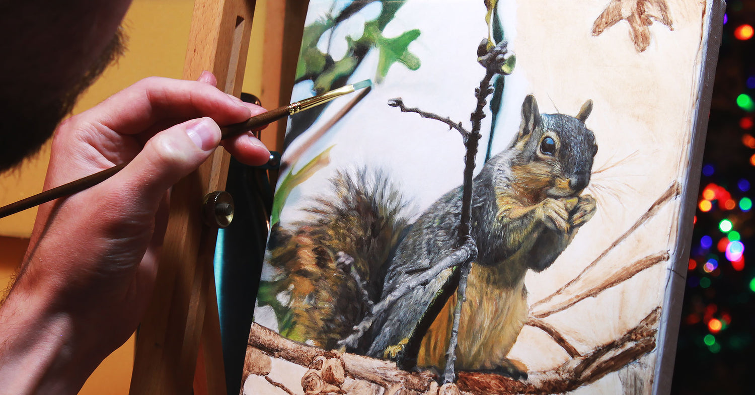 Artist Joshua Martin, painting a photorealistic painting of a squirrel.